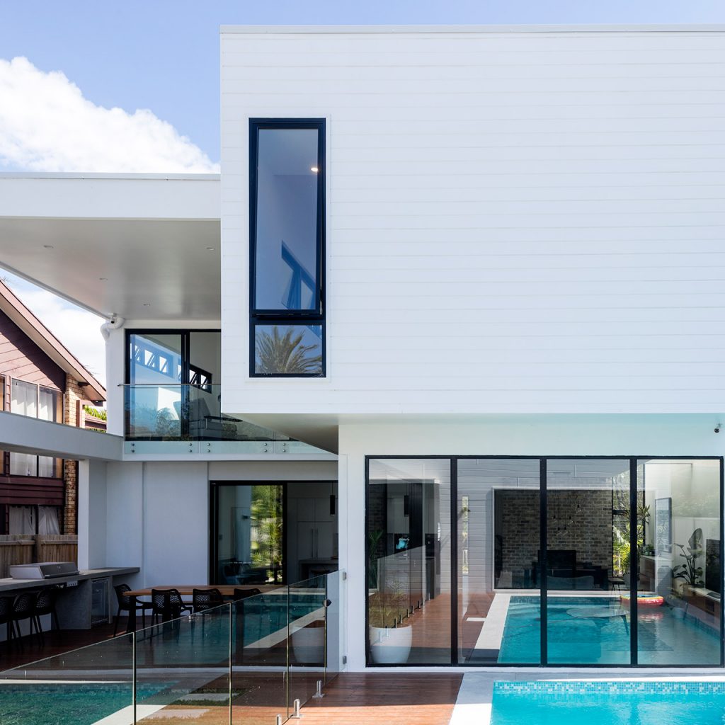 Selflok Ecogroove Smooth 150mm exterior wall cladding featured on this double story home with outdoor entertaining area and pool.