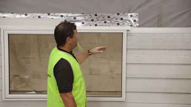 The panel cut must accommodate the head flashing’s projecting end.